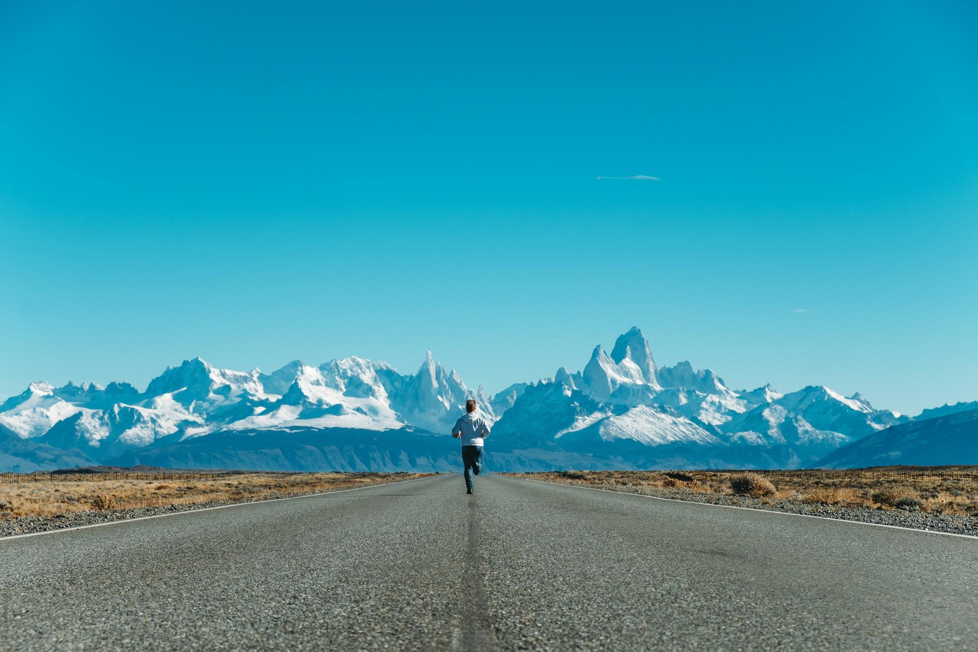 Runner running with mountains in the distance